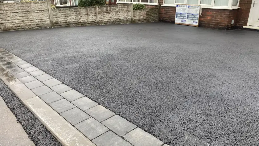 Driveways in Lichfield. Tarmac driveways with grey block paving entrance pattern and border.