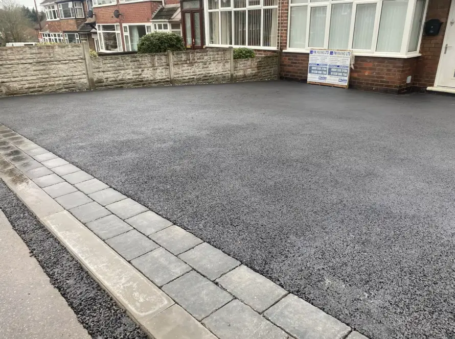 Driveways in Lichfield. Tarmac driveways with grey block paving entrance pattern and border.
